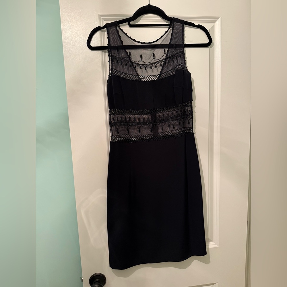 Elegant Black Sleeveless Beaded Dress with Sheer Details